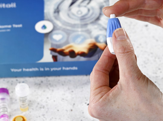 Customer collecting a blood-sample in the UK Customer collecting a blood-sample in the UK